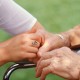 Nurse Holding Elderly Patient's Hand