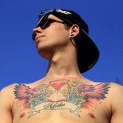 Noel, 21, from Hungary shows his tattoo during the Sziget music festival on an island in the Danube River in Budapest