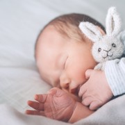 Newborn sleep at first days of life. Portrait of new born baby o